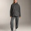 Veste oversize en peaux lainées avec capuche doublée de fausse fourrure Veste oversize en peaux lainées avec capuche doublée de fausse fourrure