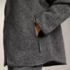 Veste oversize en peaux lainées avec capuche doublée de fausse fourrure Veste oversize en peaux lainées avec capuche doublée de fausse fourrure